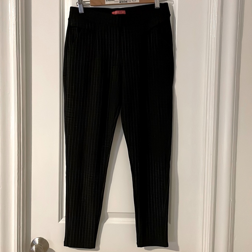 Size M, women’s black with white stripes leggings. Polyester and spandex blend.